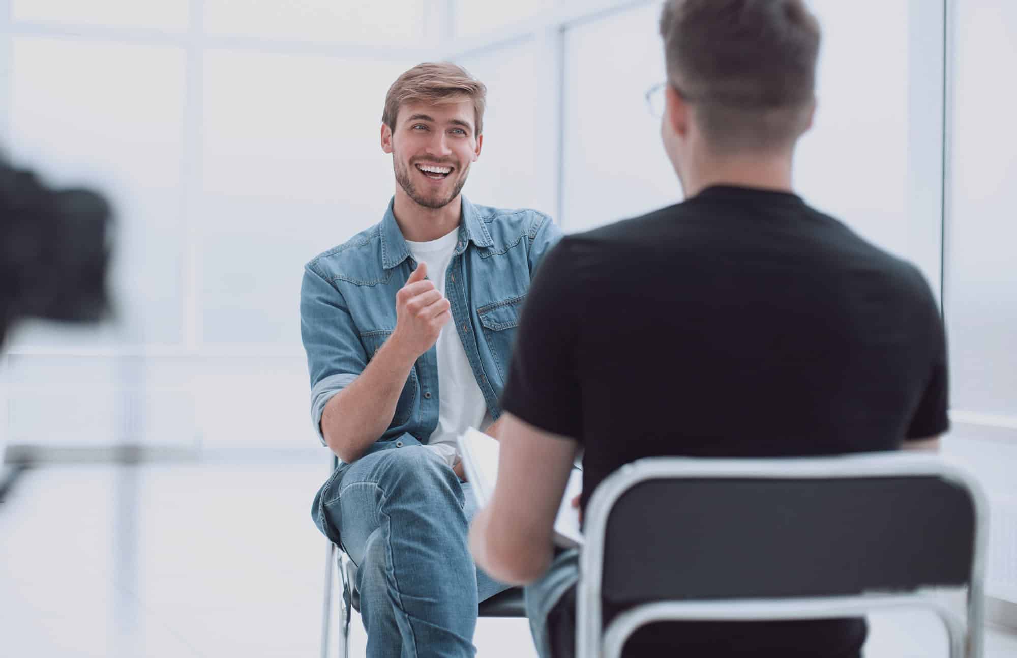 Two men talking to each other