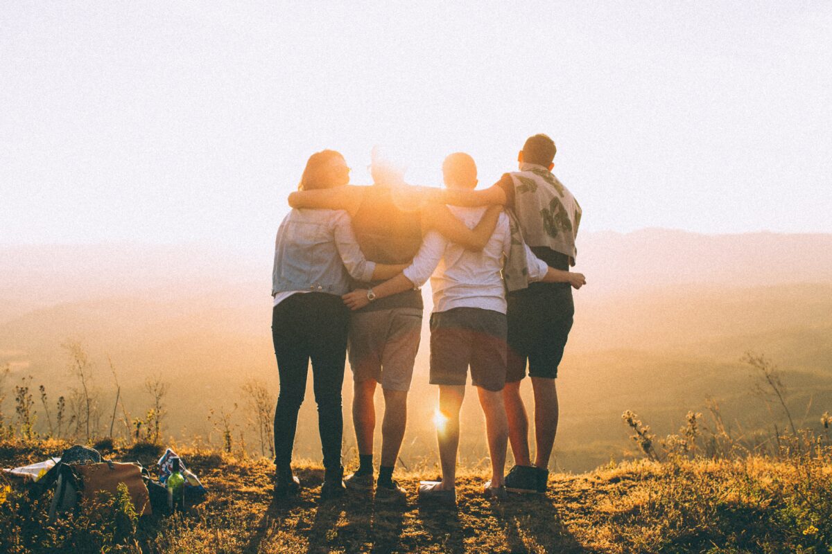 4 people on the top of a mountain