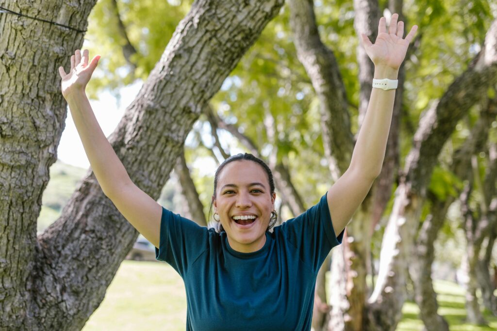 a woman celebrating small wins in ongoing recovery process to build self confidence and resilience 