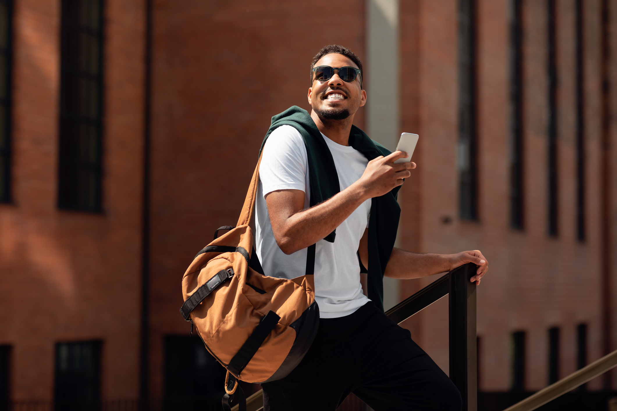 Early 30s man walking out of a New Hampshire outpatient rehab center after completing treatment